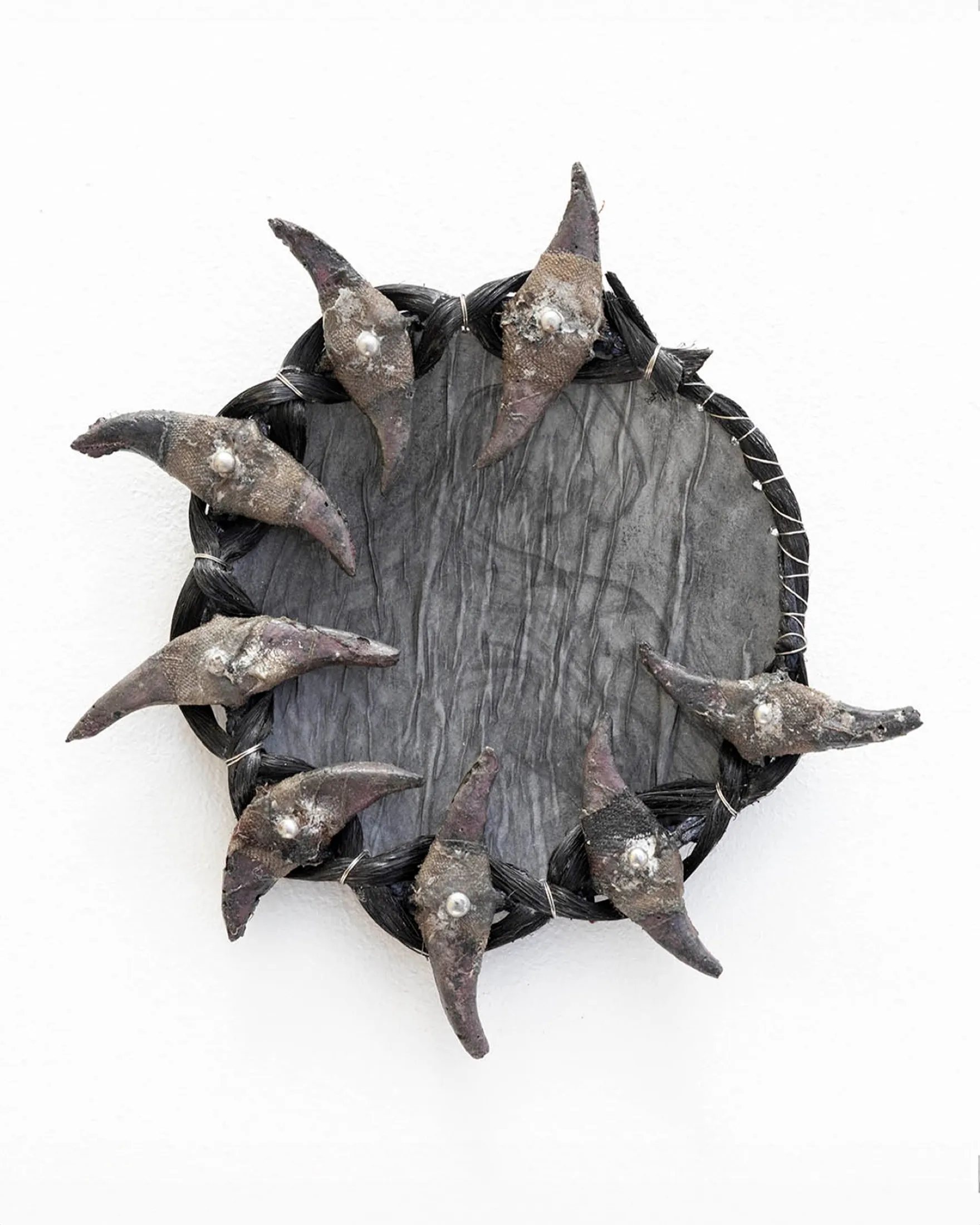 Godsend (eclipse 7) — 2023, Cement, graphite, hair, steel, rope, silk, tin, 15 × 15 × 3 cm, by Taka Kono