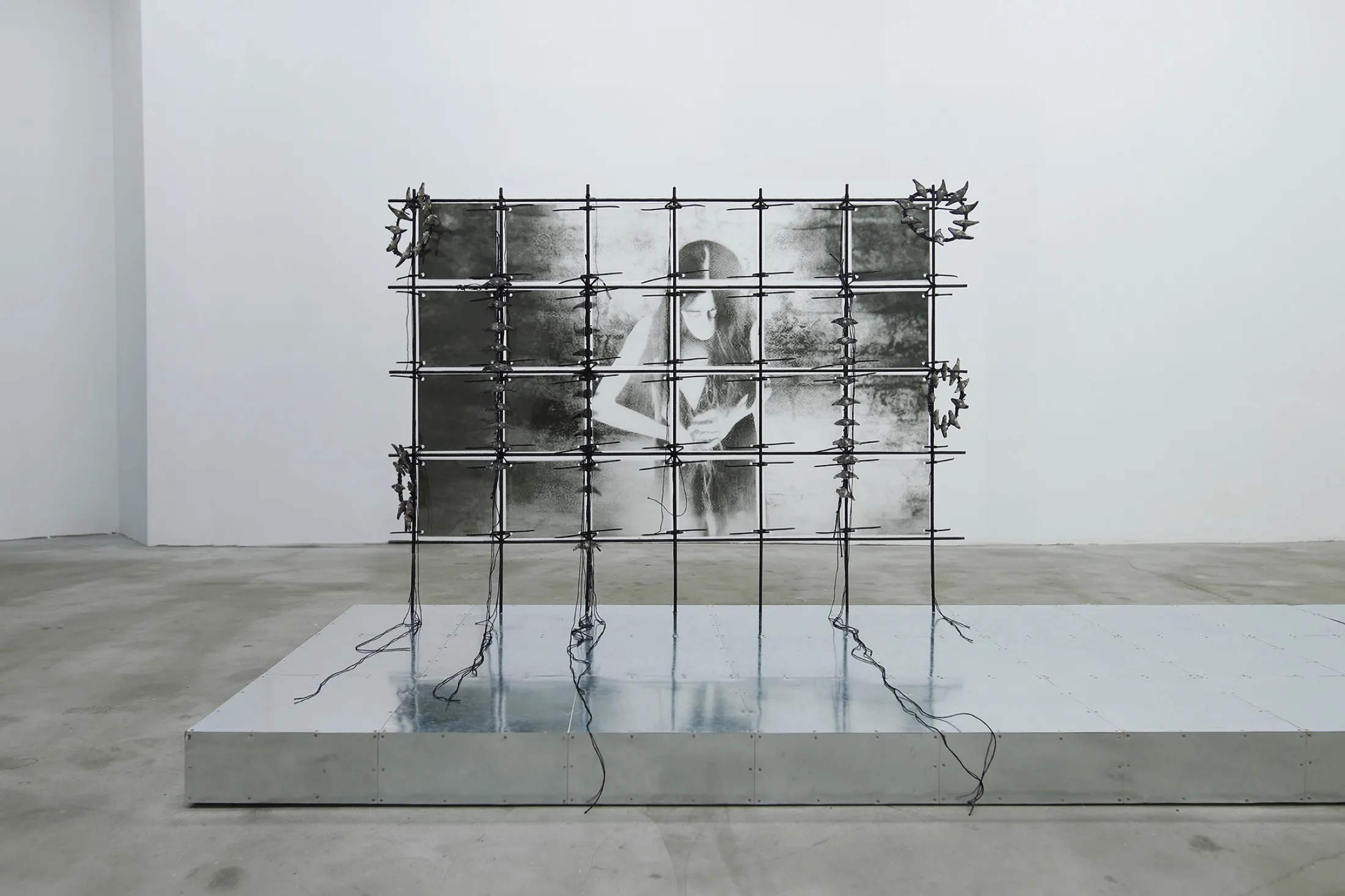 Godsend (honey and sun) — 2023, Galvanized steel, steel rods, resin, zipties, concrete, tin, ropes, hair, 63 × 336 × 50 cm, by Taka Kono
