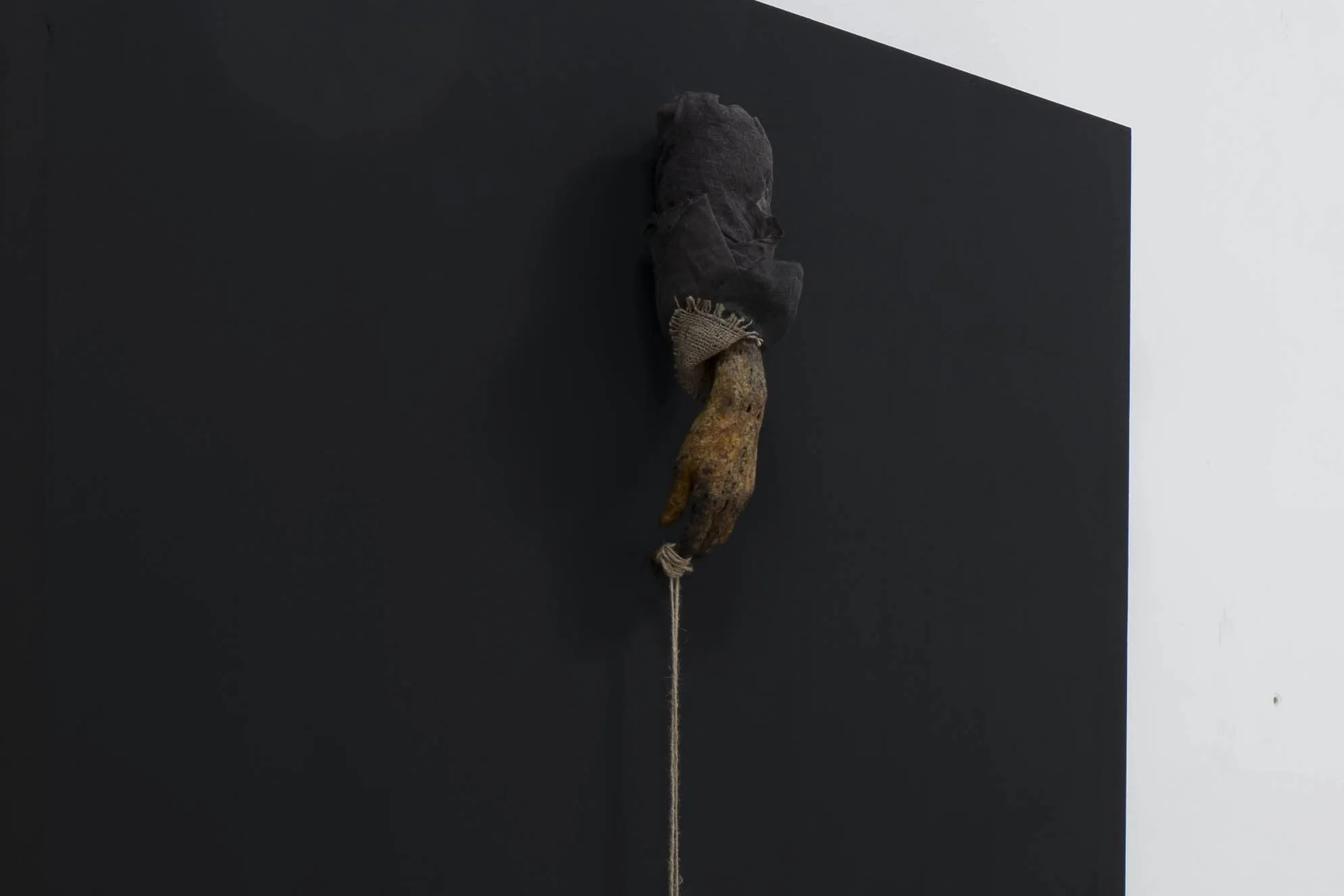 Hand with Three Strings — 2026, Expanding foam, latex, ink, natural-dyed gauze, jute, hide glue, painted wood panel, string, found and handmade objects, 244 × 122 × 33 cm, by Taka Kono